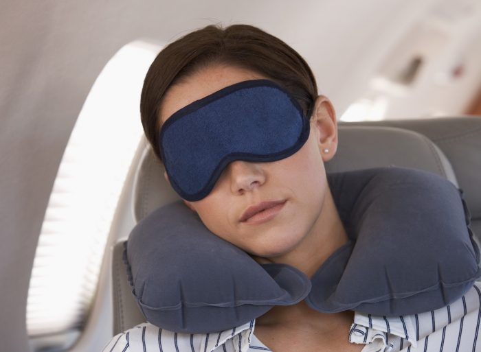 Woman with Sleep mask on airplane.jpg